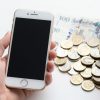 Smartphone and UK currency representing mobile phone deals.